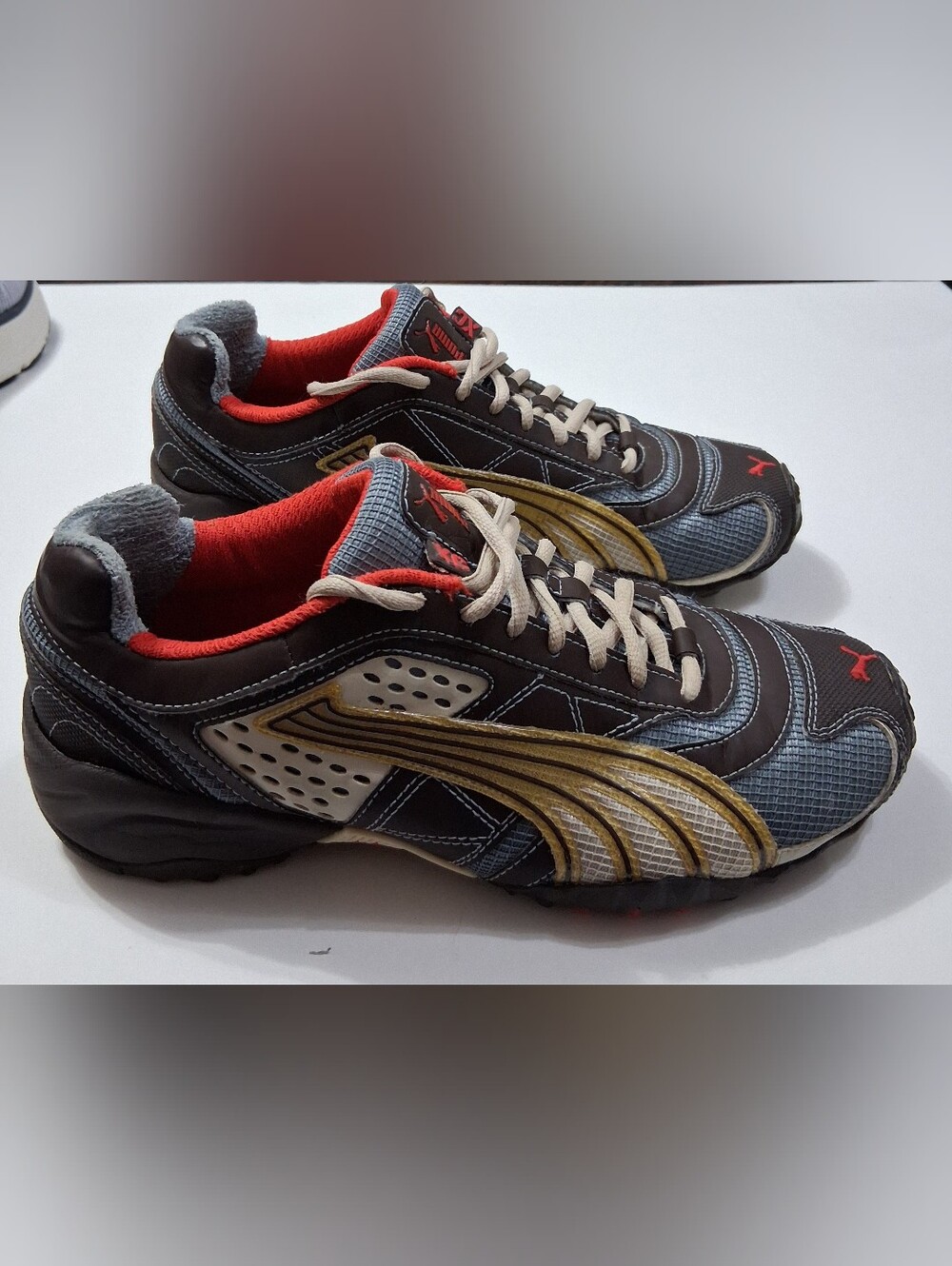 Puma Men's Sneakers in Black, Gold and Red